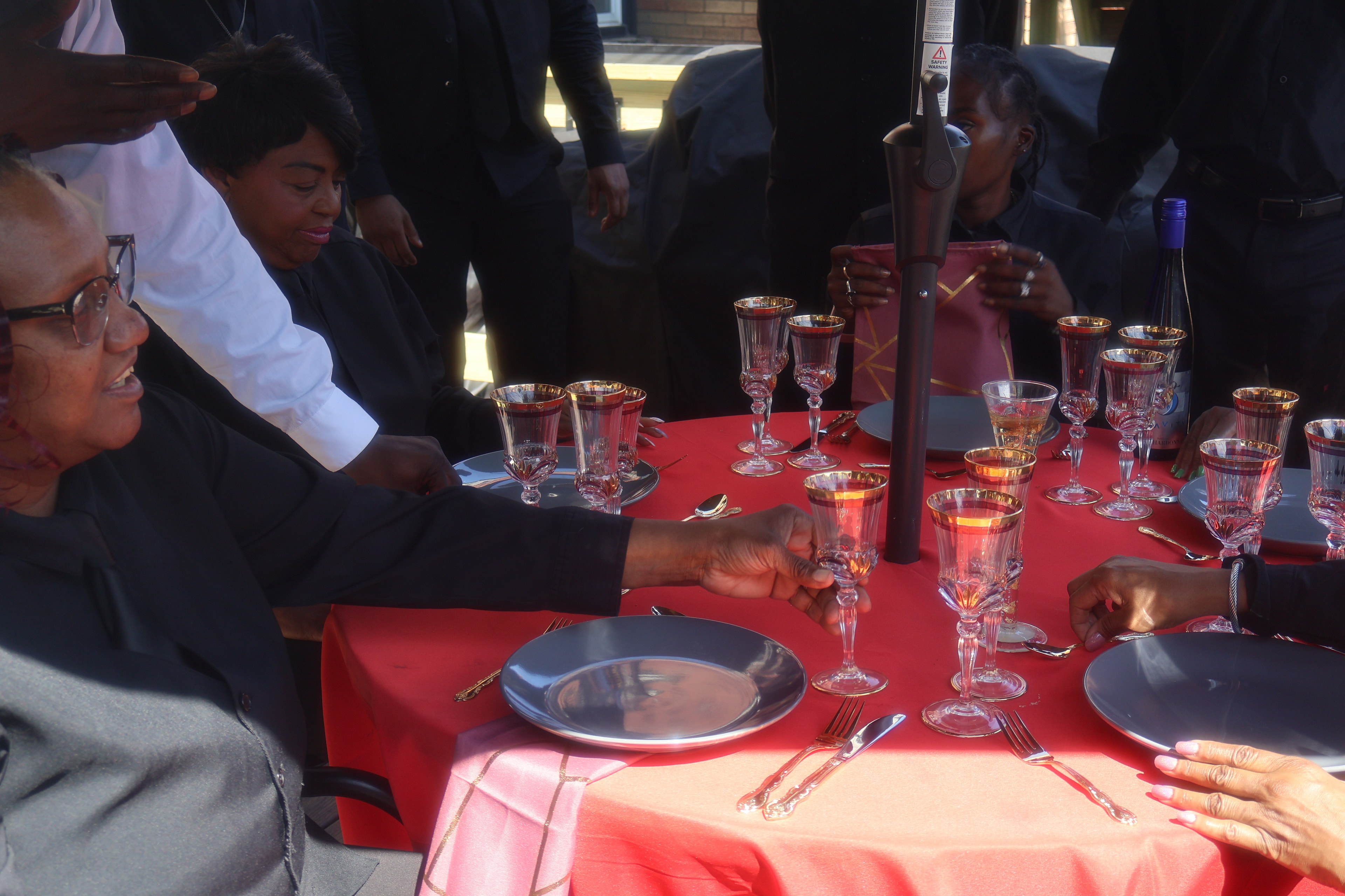 Elegant red table setting with crystal glassware