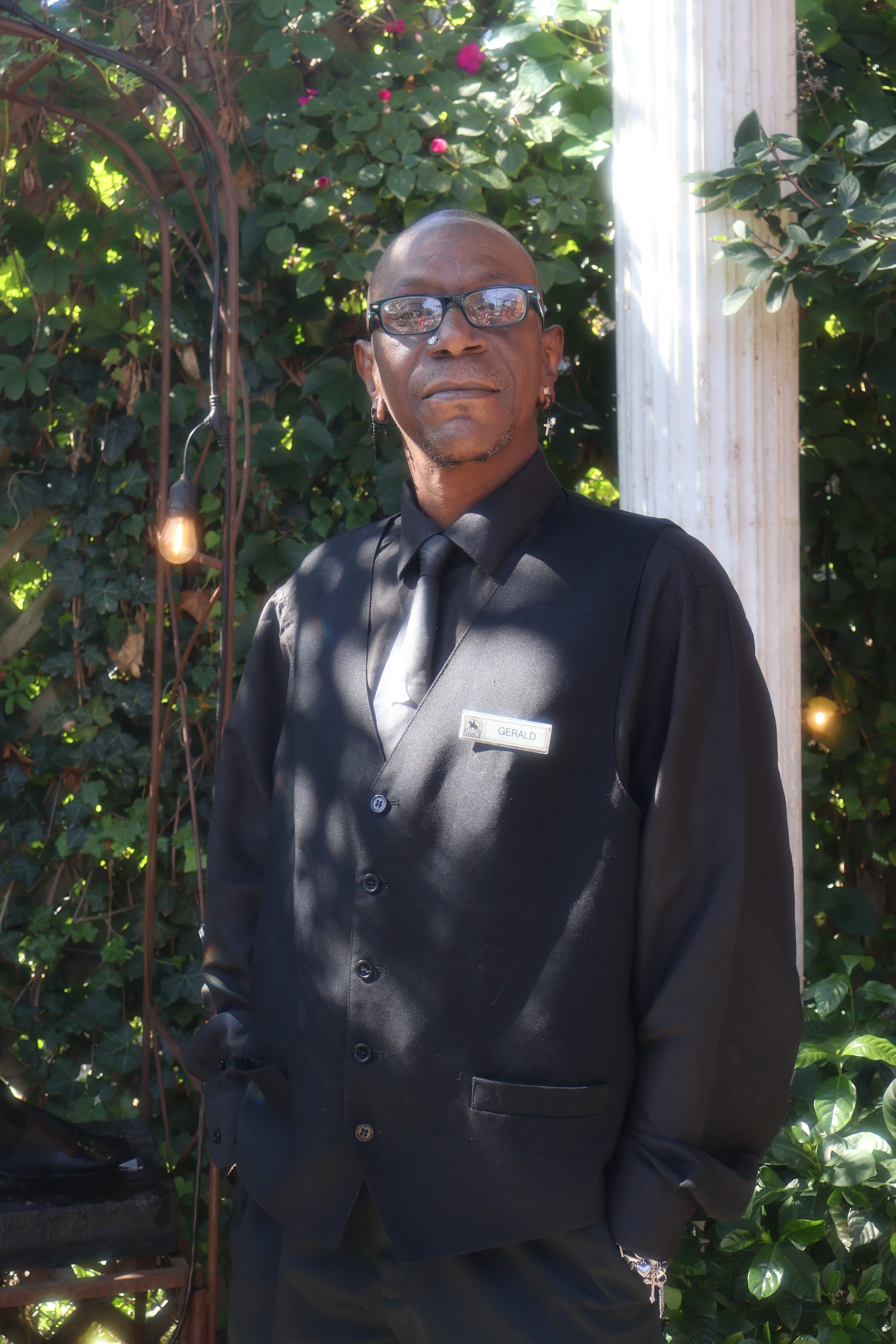 C'est Si Bon staff member portrait in garden