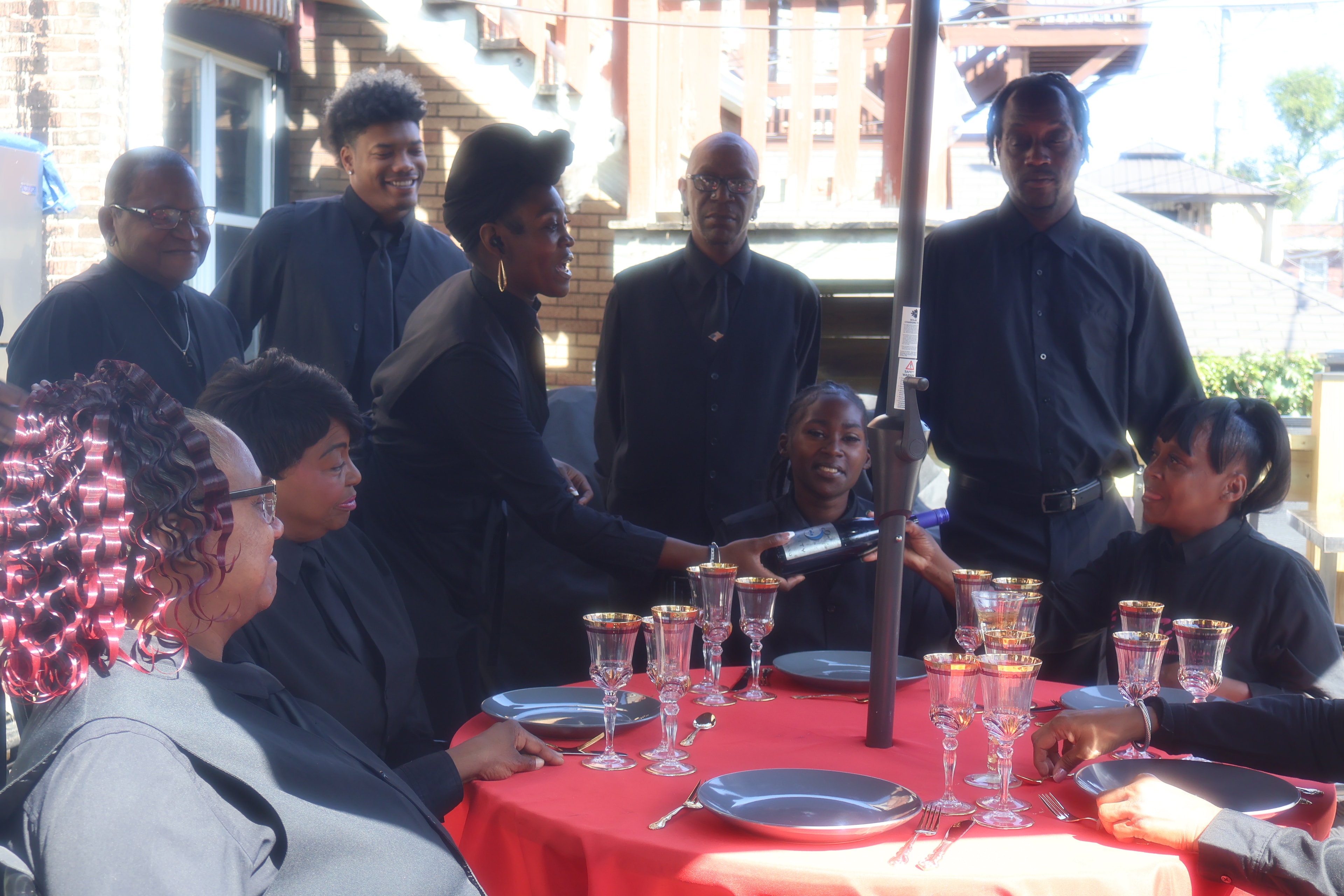 C'est Si Bon team serving at a formal event